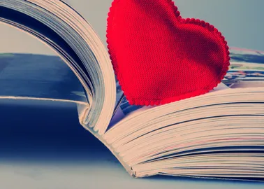 Red heart inside a book